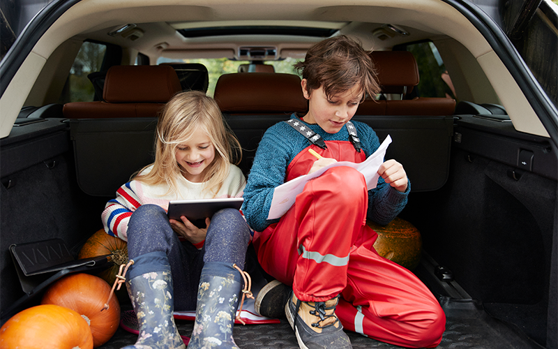A boy and girl looking at tablet