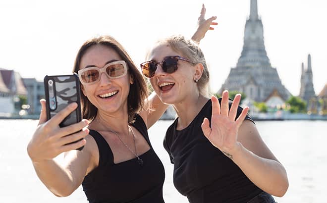women taking selfie with smile
