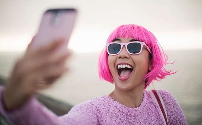 A woman gazing at her mobile