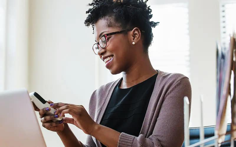 A women is looking at mobile